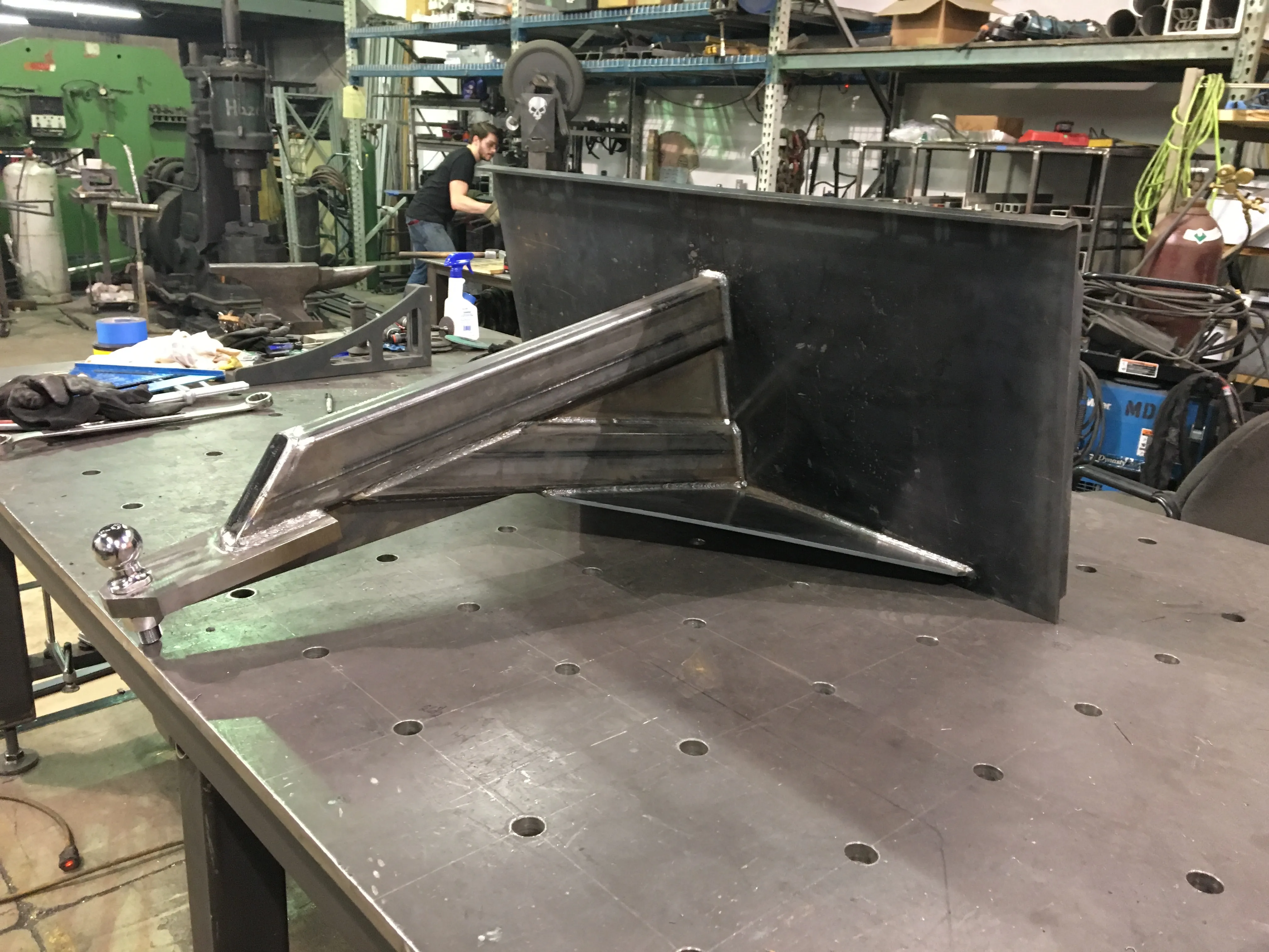 Custom steel assembly positioned on a fabrication table