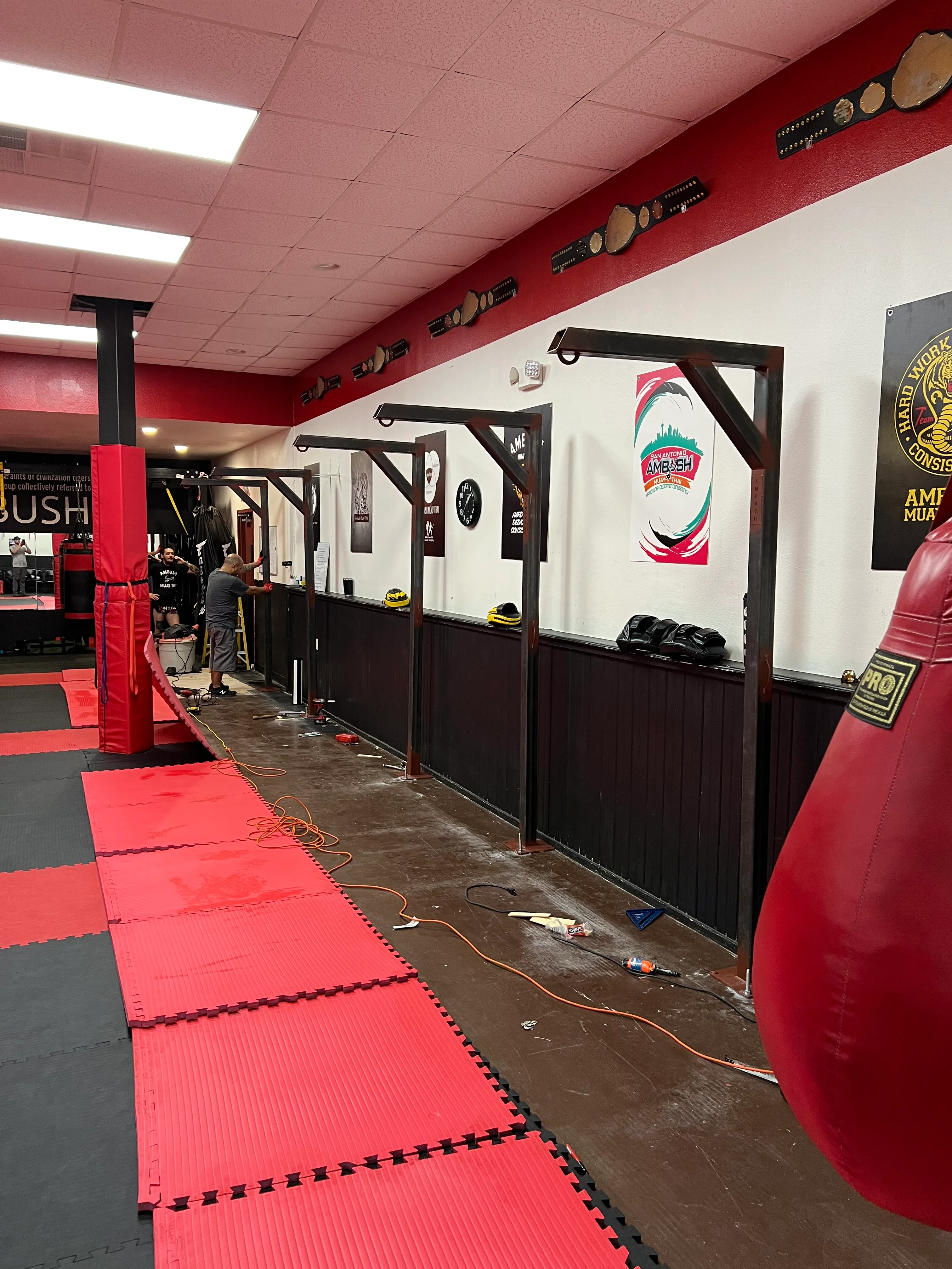 Wall-mounted steel storage racks in a training facility
