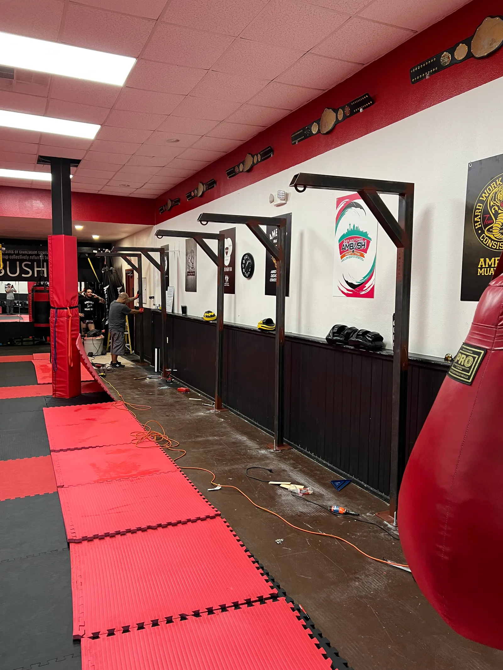 Wall-mounted steel storage racks in a training facility