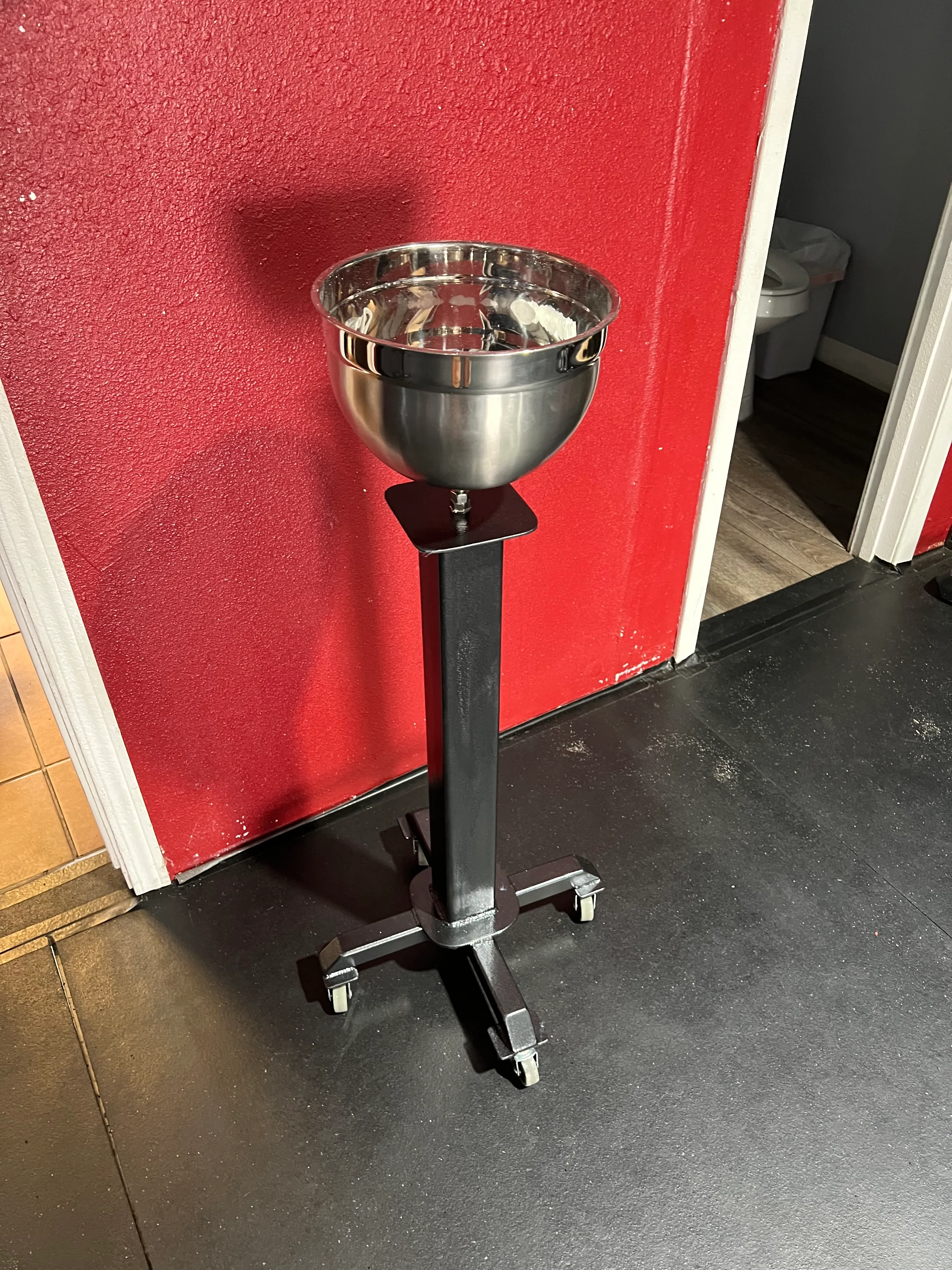 Custom steel mounting fixture installed on a workbench