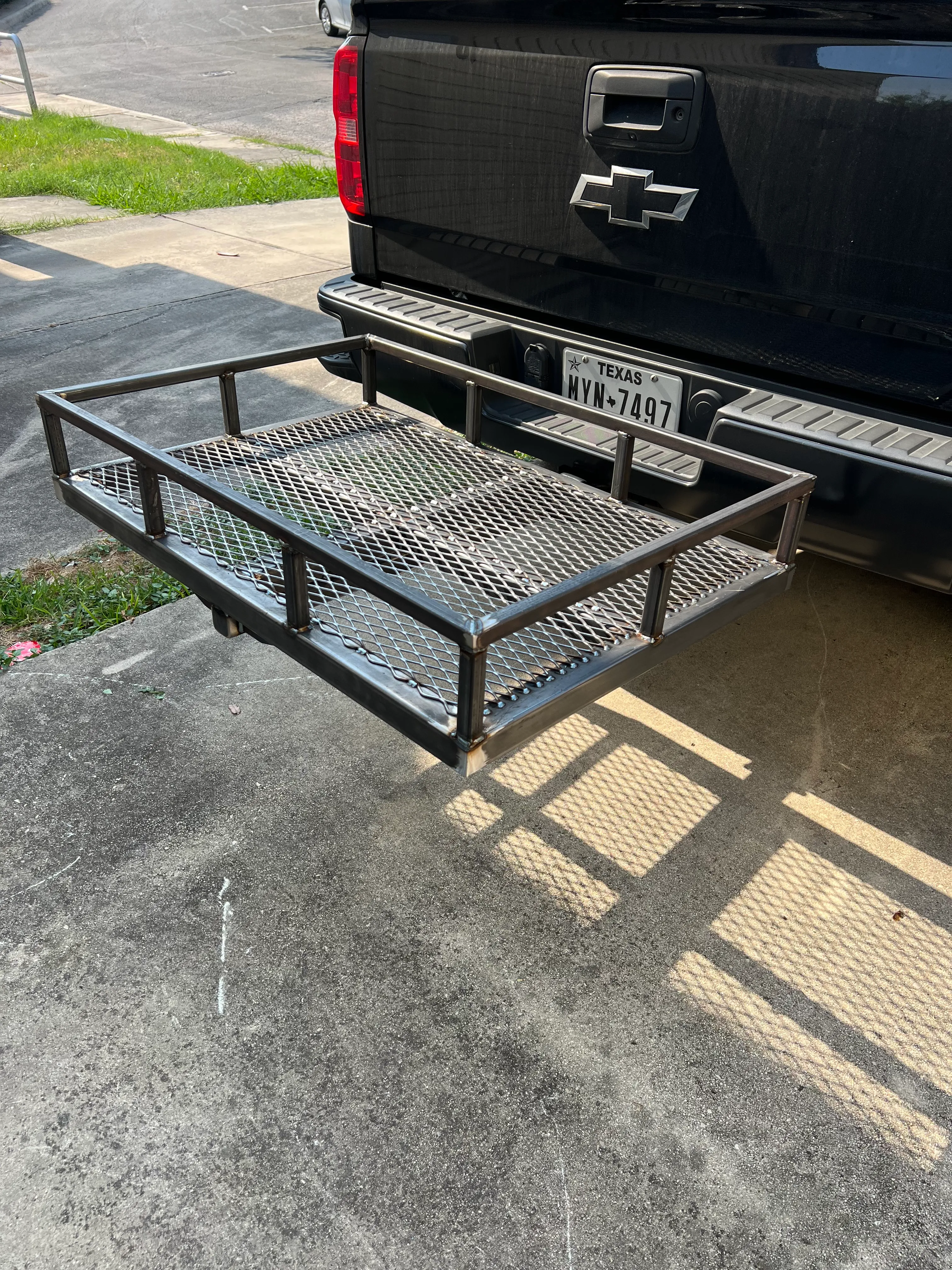 Custom metal rack fitted to a pickup truck bed