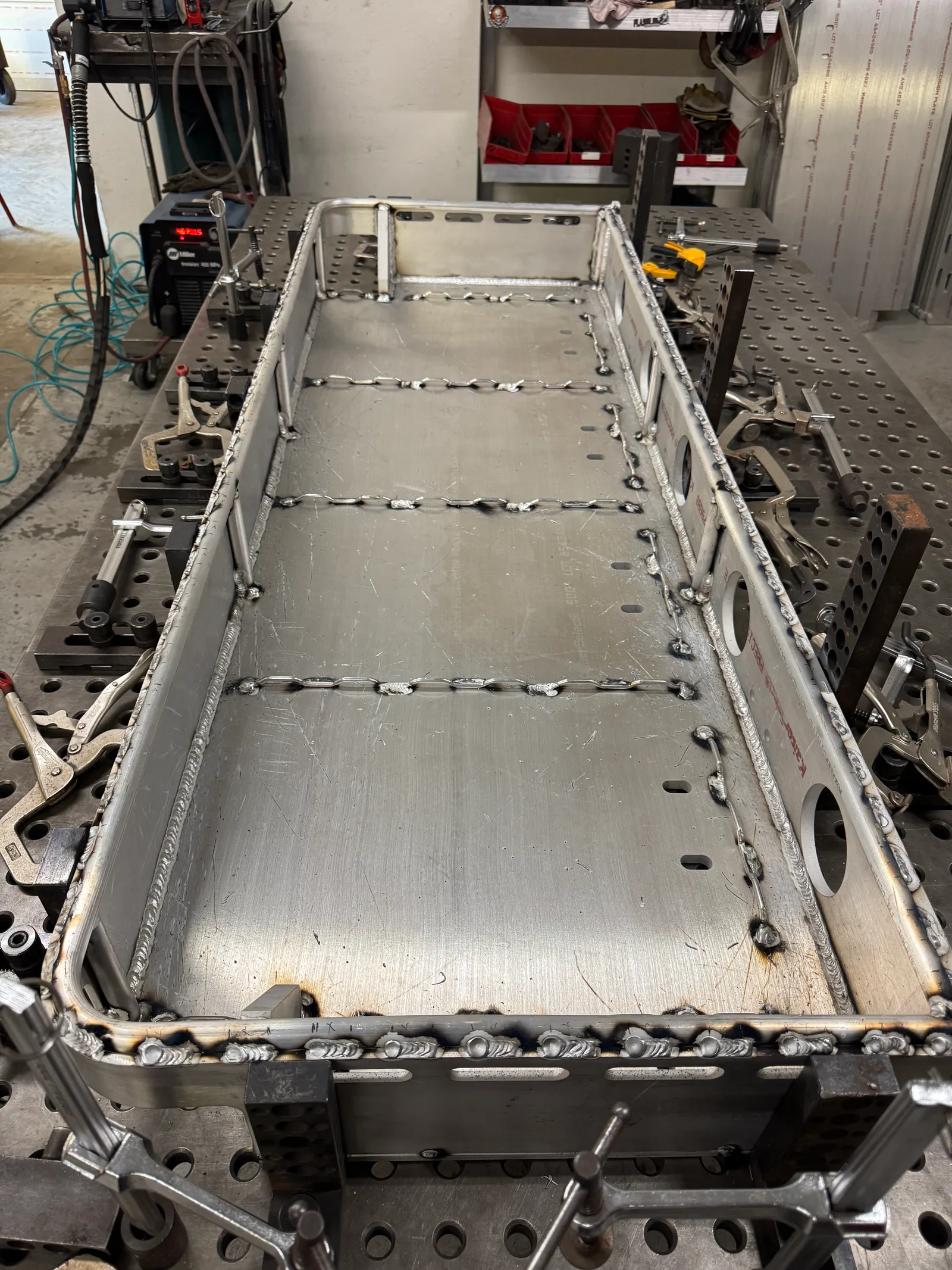 Large aluminum structure secured for precision fabrication